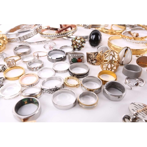 174 - A lot consisting of assorted base metal jewellery, including various chains, rings, bangles and neck... 