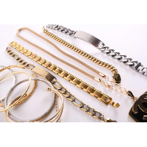 174 - A lot consisting of assorted base metal jewellery, including various chains, rings, bangles and neck... 