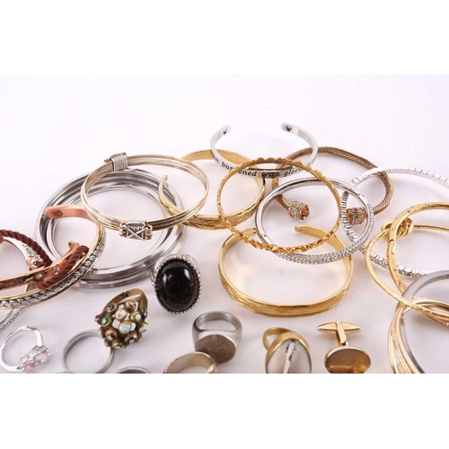 174 - A lot consisting of assorted base metal jewellery, including various chains, rings, bangles and neck... 