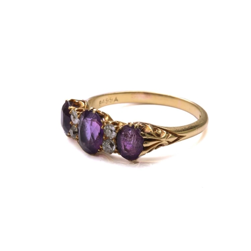 175 - An amethyst and diamond half hoop ring, comprising three graduated oval-shaped amethysts, claw set i... 