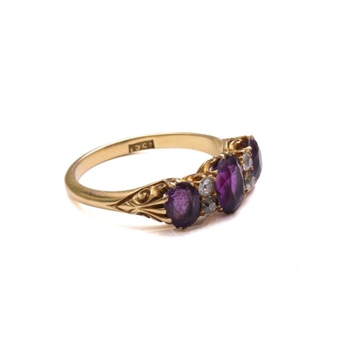 175 - An amethyst and diamond half hoop ring, comprising three graduated oval-shaped amethysts, claw set i... 