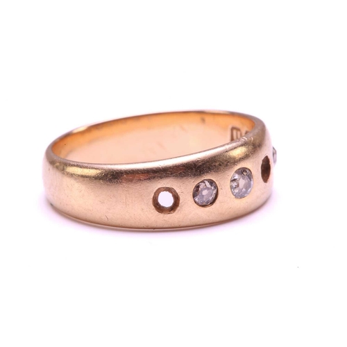 18 - An 18ct gold ring set with diamonds, comprising a plain band and later-added gemstones, graduated si... 