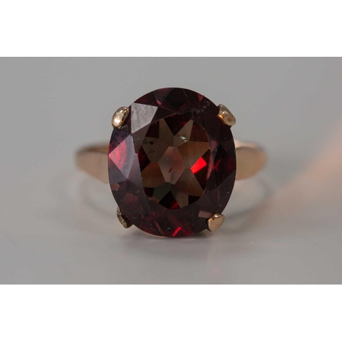 182 - A highly prized collectors colour-changing garnet ring, featuring an oval-shaped garnet displaying t... 