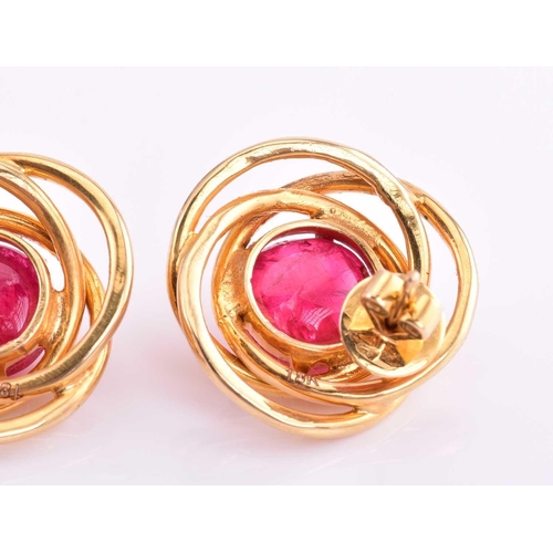 185 - A pair of red spinel earrings, each consisting of a round red spinel cabochon approximately measurin... 