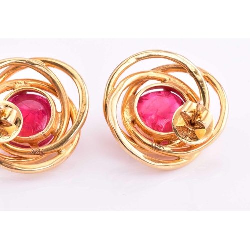 185 - A pair of red spinel earrings, each consisting of a round red spinel cabochon approximately measurin... 