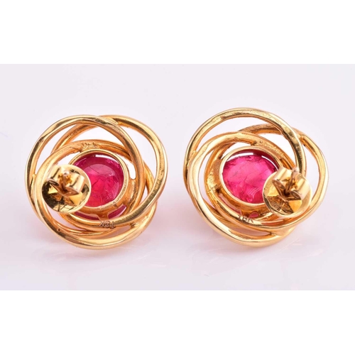 185 - A pair of red spinel earrings, each consisting of a round red spinel cabochon approximately measurin... 