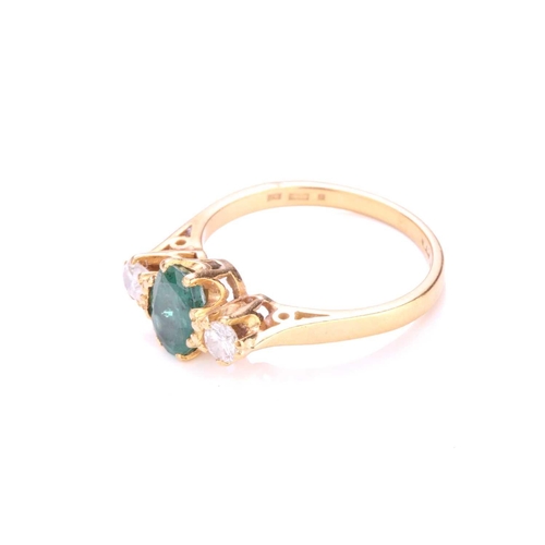 193 - A three-stone emerald and diamond ring, centrally set with an oval-cut emerald with deep green body ... 