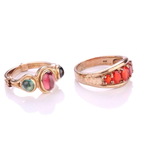 2 - Two gem-set rings in 9ct yellow gold; to include a cocktail ring consisting of an oval garnet flanke... 