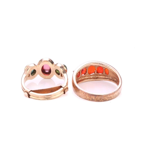 2 - Two gem-set rings in 9ct yellow gold; to include a cocktail ring consisting of an oval garnet flanke... 