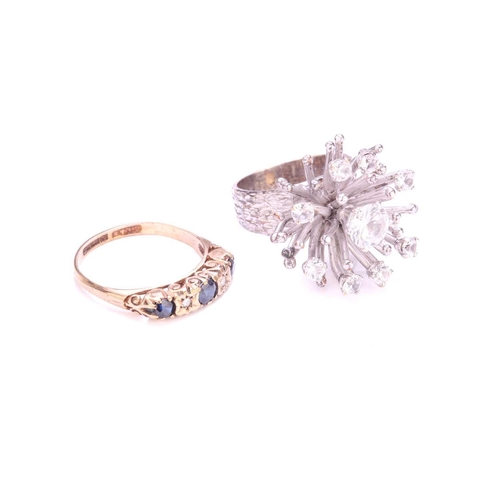 213 - A three-stone half hoop ring in 9ct gold, and another; comprising two sapphires and a replacement pa... 