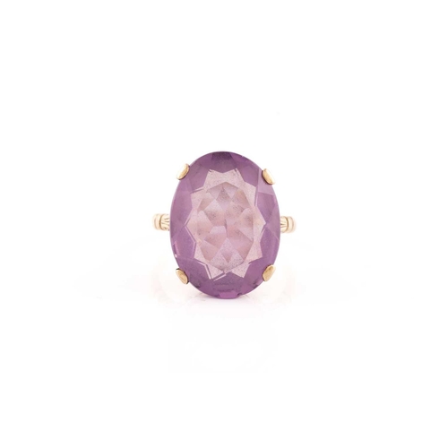 220 - Two gem set dress rings; the first an oval cut amethyst in a mount marked 9ct, size Q; together with... 