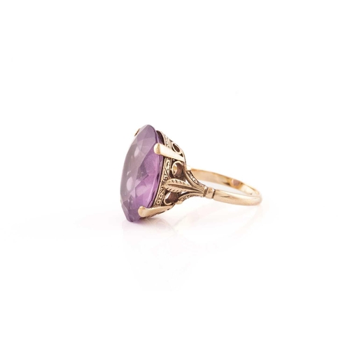 220 - Two gem set dress rings; the first an oval cut amethyst in a mount marked 9ct, size Q; together with... 