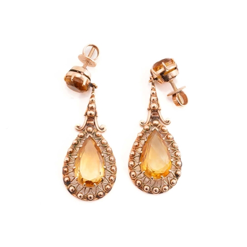 227 - A citrine demi-parure, including a pair of drop earrings, a ring and a pendant; The pair of earrings... 