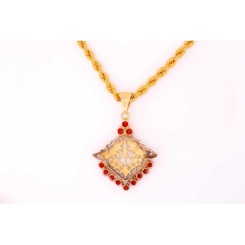 233 - A precious coral and seed pearl pendant on a twisted rope chain, the pendant of foliate design compr... 