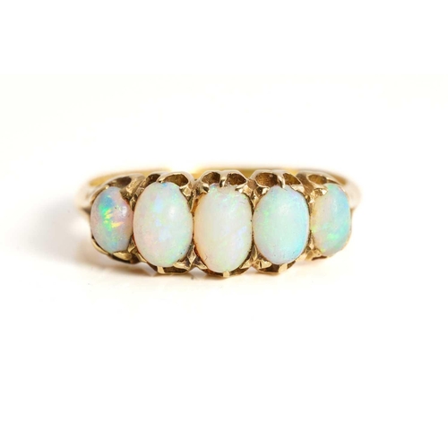 240 - A five-stone opal half hoop ring in 18ct gold, featuring five graduating precious opal cabochons cla... 