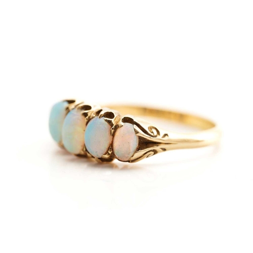 240 - A five-stone opal half hoop ring in 18ct gold, featuring five graduating precious opal cabochons cla... 