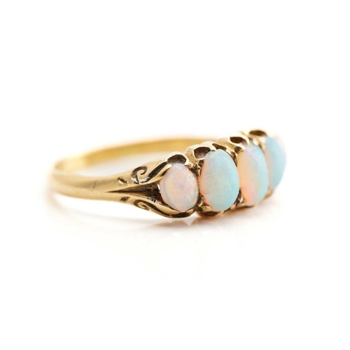 240 - A five-stone opal half hoop ring in 18ct gold, featuring five graduating precious opal cabochons cla... 