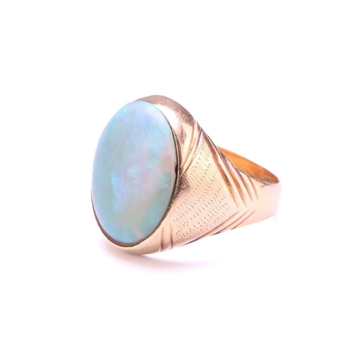 247 - A signet ring set with precious opal, where the oval cabochon displaying mild play-of-colours rangin... 