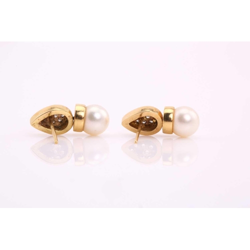 265 - A pair of pearl and diamond earrings, each consisting of an 8.5 mm cream coloured pearl with pink ov... 