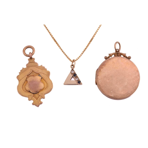 269 - A gem-set pendant on chain, a pendant and a locket; the triangle pendant is set with two brilliant-c... 