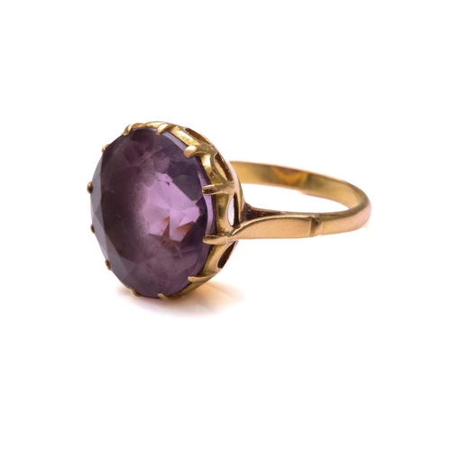 27 - An amethyst dress ring, comprising a round mixed-cut amethyst of size 14.8 mm, mounted in coronet se... 