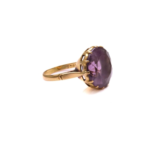 27 - An amethyst dress ring, comprising a round mixed-cut amethyst of size 14.8 mm, mounted in coronet se... 