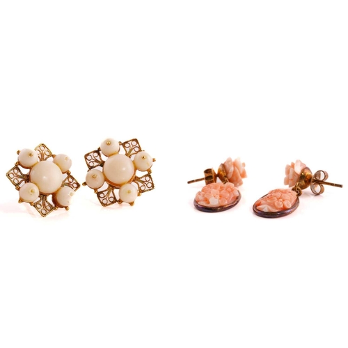 271 - Two pairs of coral earrings, including a pair of floral drop earrings, each consists of an oval carv... 