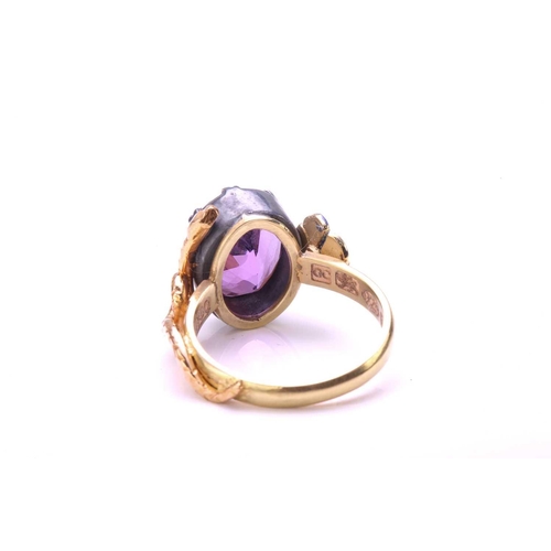 272 - An amethyst dress ring with 18ct gold and silver, comprises an oval-cut amethyst in silver open-back... 