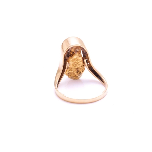 283 - A nugget ring embellished with diamonds, featuring a yellow metal nugget (tests as high carat gold) ... 