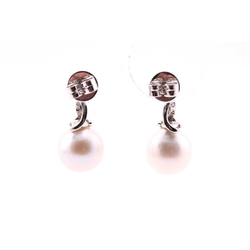 286 - A pair of South-Sea pearl and diamond earrings, the slightly off-round pearls with diamond set scrol... 