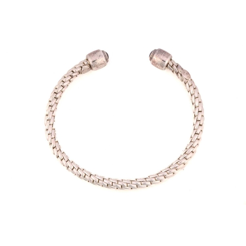 29 - FOPE - A Silver Fope bangle with sapphires from the 'Ice' collection, comprising an open bangle with... 