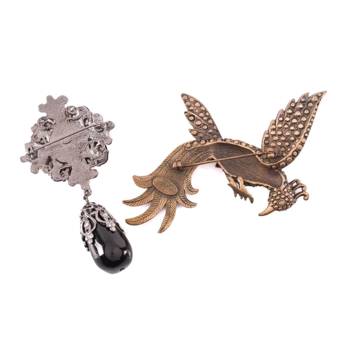 302 - Two costume brooches; to include a Chanel two-toned cluster brooch with a drop decoration, signed 'C... 