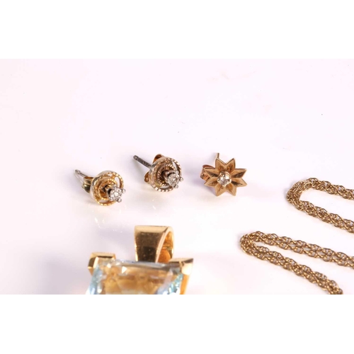 306 - A small collection of jewellery; including a large topaz pendant, with pale blue body colour of size... 