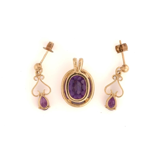 316 - An amethyst pendant and a pair of drop earrings in 9ct gold; the pendant features an oval faceted am... 