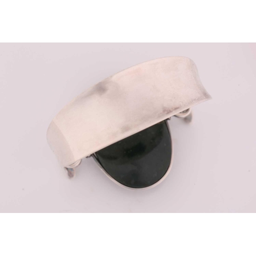 333 - Georg Jensen - 'Arm Ring' with moss agate, a tension clamp opening bangle with an oval moss agate pa... 