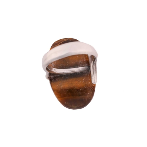 337 - Georg Jensen - a tiger's eye dress ring, to an open ring shank, designed by Vivianna Torun Bülow-Hüb... 