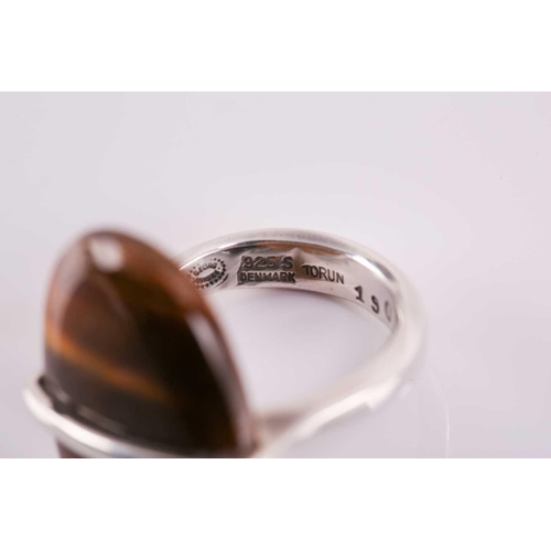 337 - Georg Jensen - a tiger's eye dress ring, to an open ring shank, designed by Vivianna Torun Bülow-Hüb... 