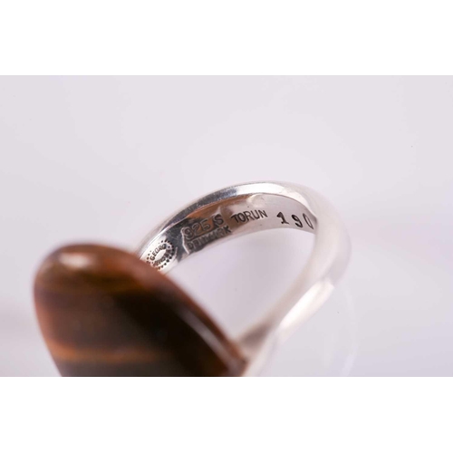 337 - Georg Jensen - a tiger's eye dress ring, to an open ring shank, designed by Vivianna Torun Bülow-Hüb... 