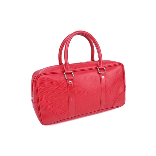 353 - A Louis Vuitton red epi-leather handbag with zip fastening and a matching card wallet together with ... 