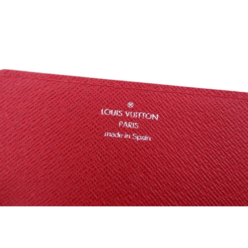 353 - A Louis Vuitton red epi-leather handbag with zip fastening and a matching card wallet together with ... 