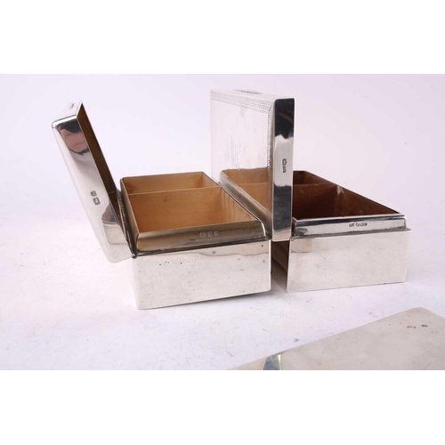 424 - Two silver cigarette boxes both of rectangular form, one with a Greek key border engraved with initi... 