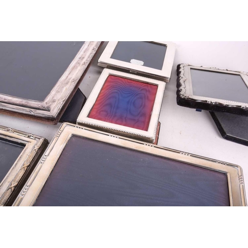 425 - A collection of nine 20th century silver photograph frames, eight with easel backs including one Gar... 