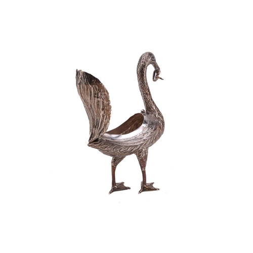 432 - A Continental silver standing swan, 19th/20th century, an eel in its beak, the top wings hinged at t... 