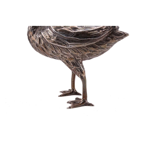 432 - A Continental silver standing swan, 19th/20th century, an eel in its beak, the top wings hinged at t... 