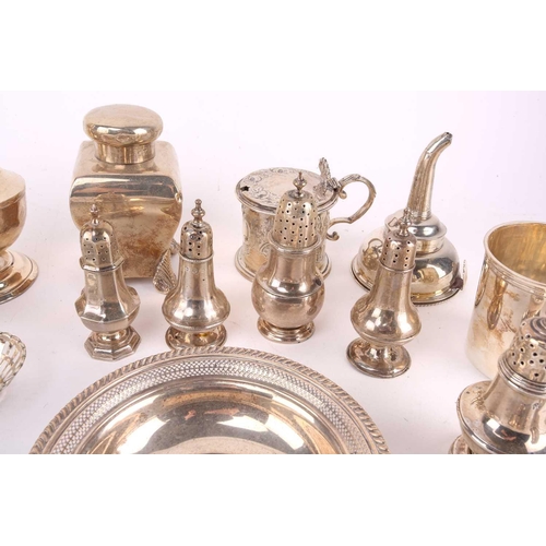 448 - A collection of Victorian and later silver hollow wares including a sugar castor, London 1938 makers... 