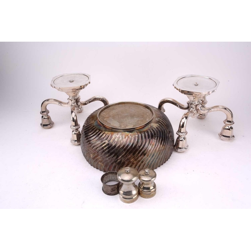 449 - A collection of silver and white metal comprising of a pair of white metal Art Deco style four branc... 