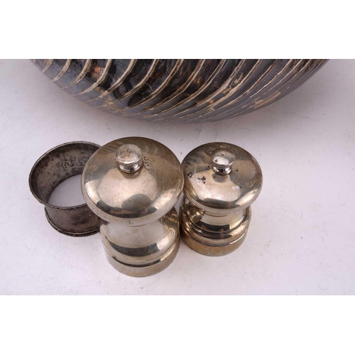 449 - A collection of silver and white metal comprising of a pair of white metal Art Deco style four branc... 