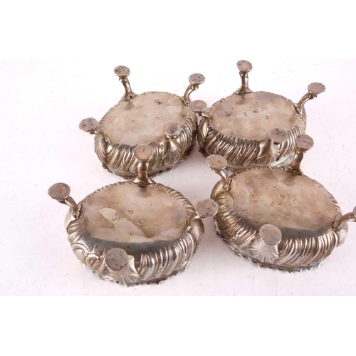 454 - A set of four George III table salt cellars, London 1766 by David & Robert Henell, the oval bodies w... 