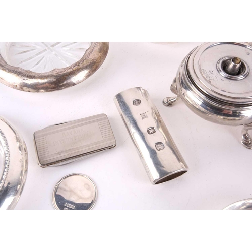 463 - A small collection of silver to include a Grenadier Guards regimental table cigar lighter, London 19... 