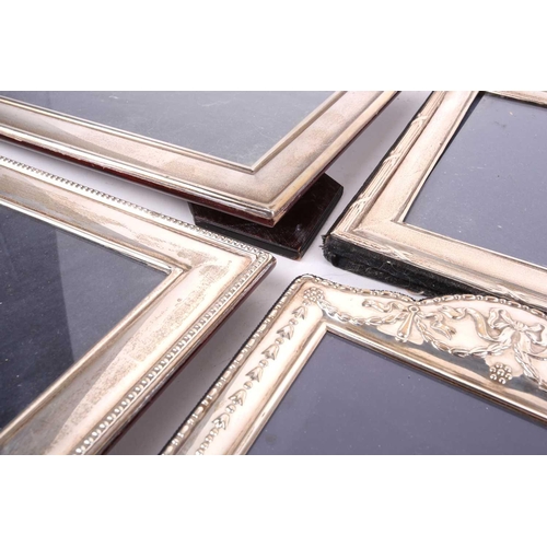 464 - A collection five modern silver fronted easel photograph frames of various design and manufature, to... 